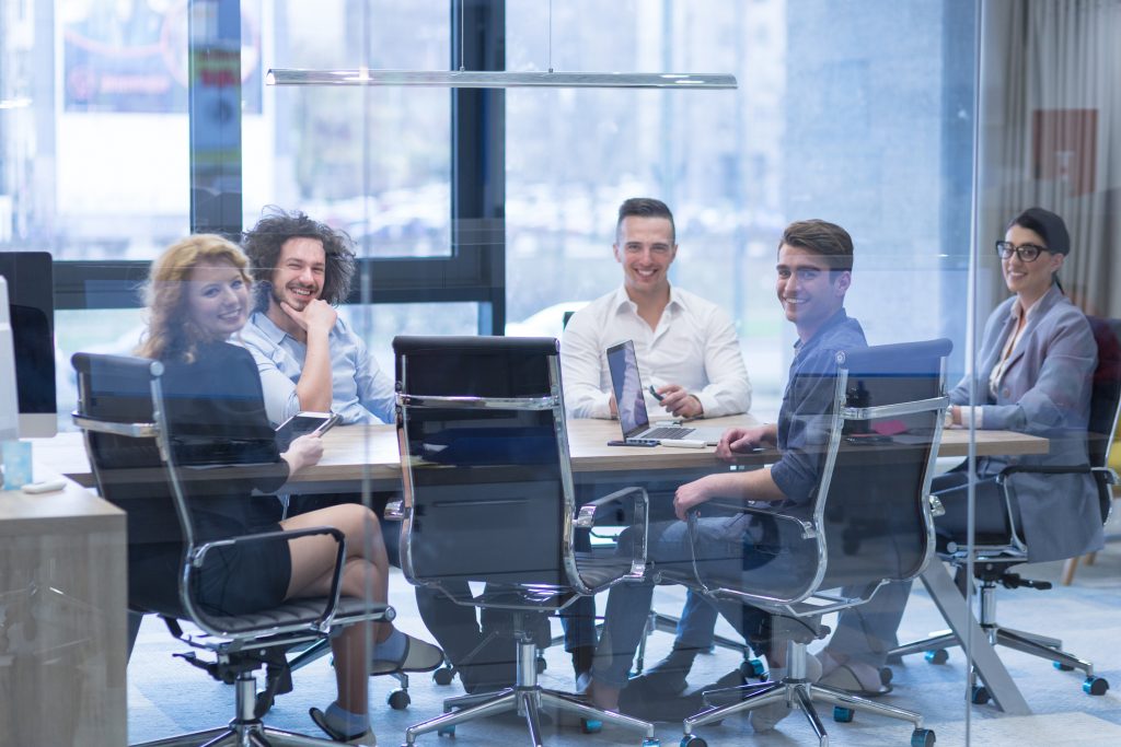 Group of business people discussing no-code development at digital enterprise office building